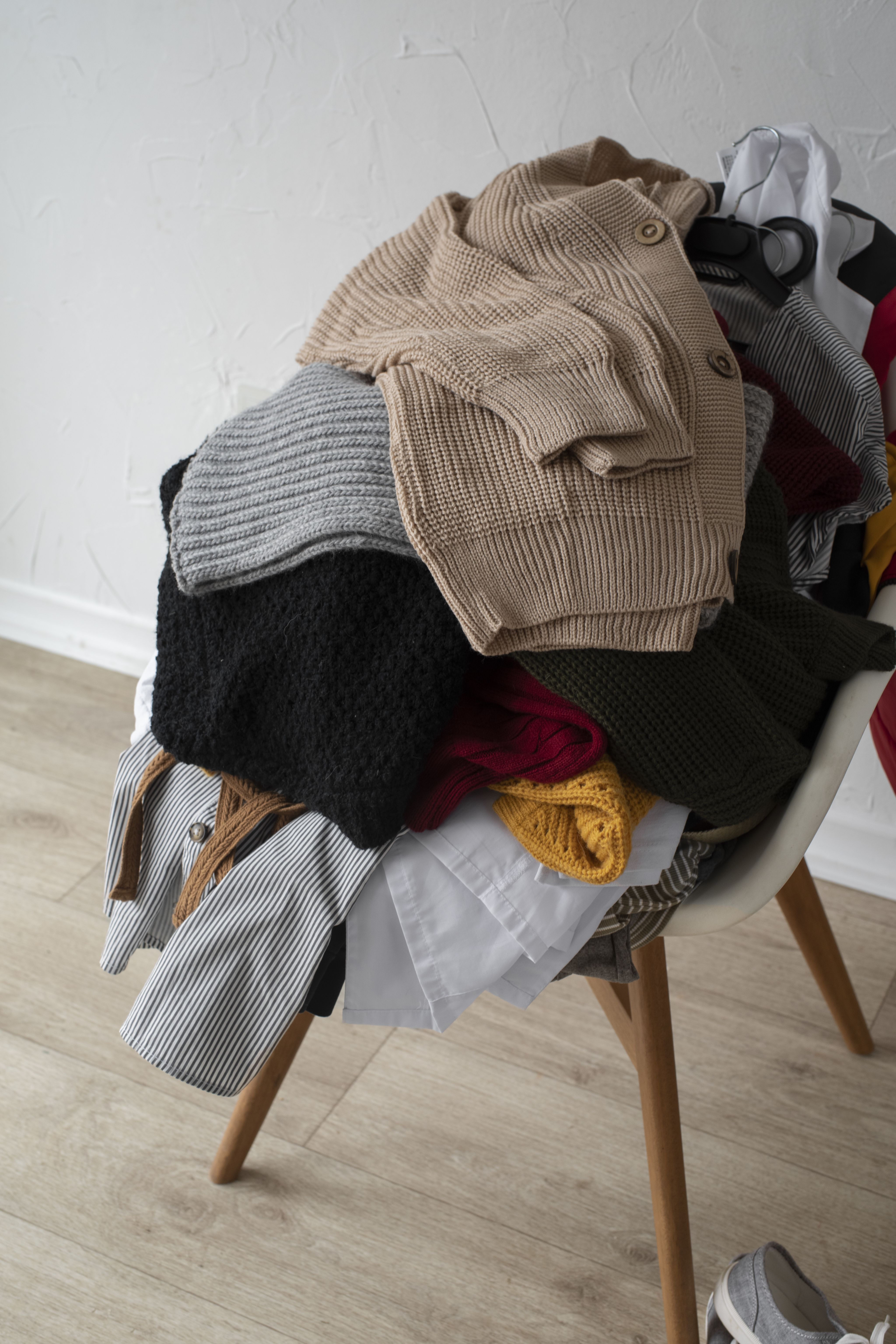 photo of woman holding white and black paper bags